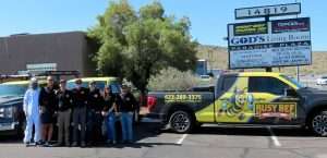 Busy Bee Pest Solutions team standing beside a branded service truck in Arizona