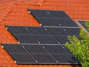 Rooftop solar array on tile, showing the gap between the panel backs and the roof surface